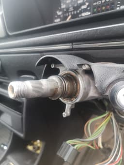 Steering column spring clip removal